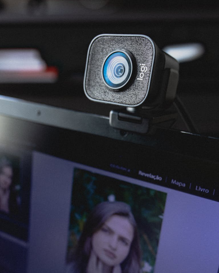 High-quality webcam positioned on laptop, ideal for online meetings and remote work setups.